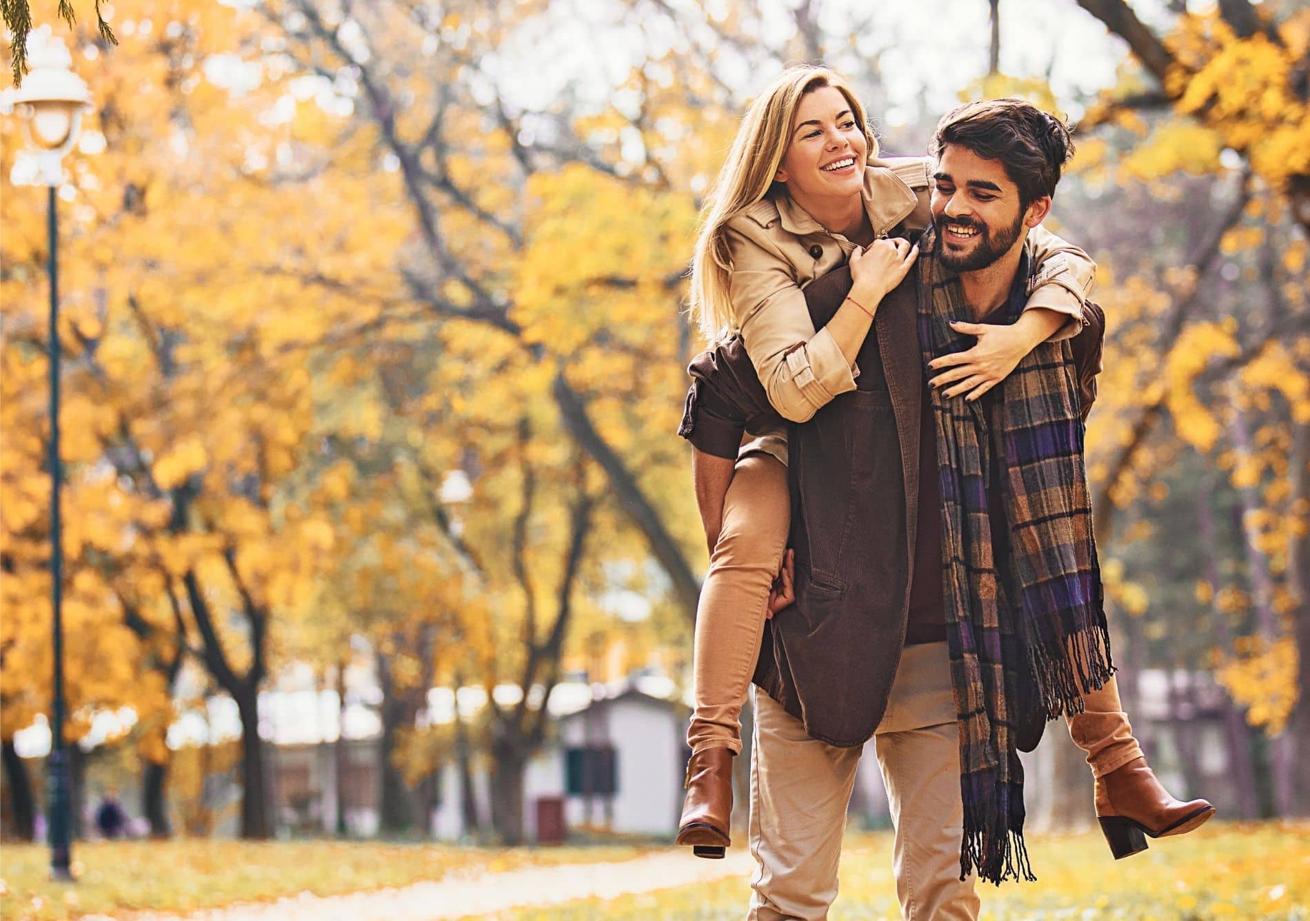 a couple enjoying fall in a park