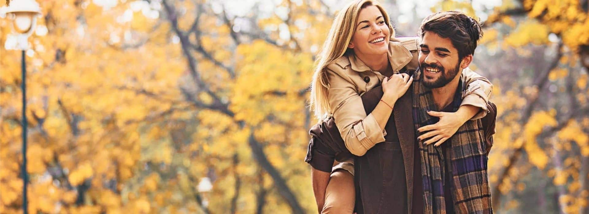 a couple enjoying fall in a park