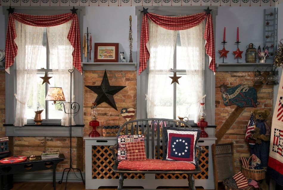 Living room with bench, large windows and an array of red, white and blue Americana decor