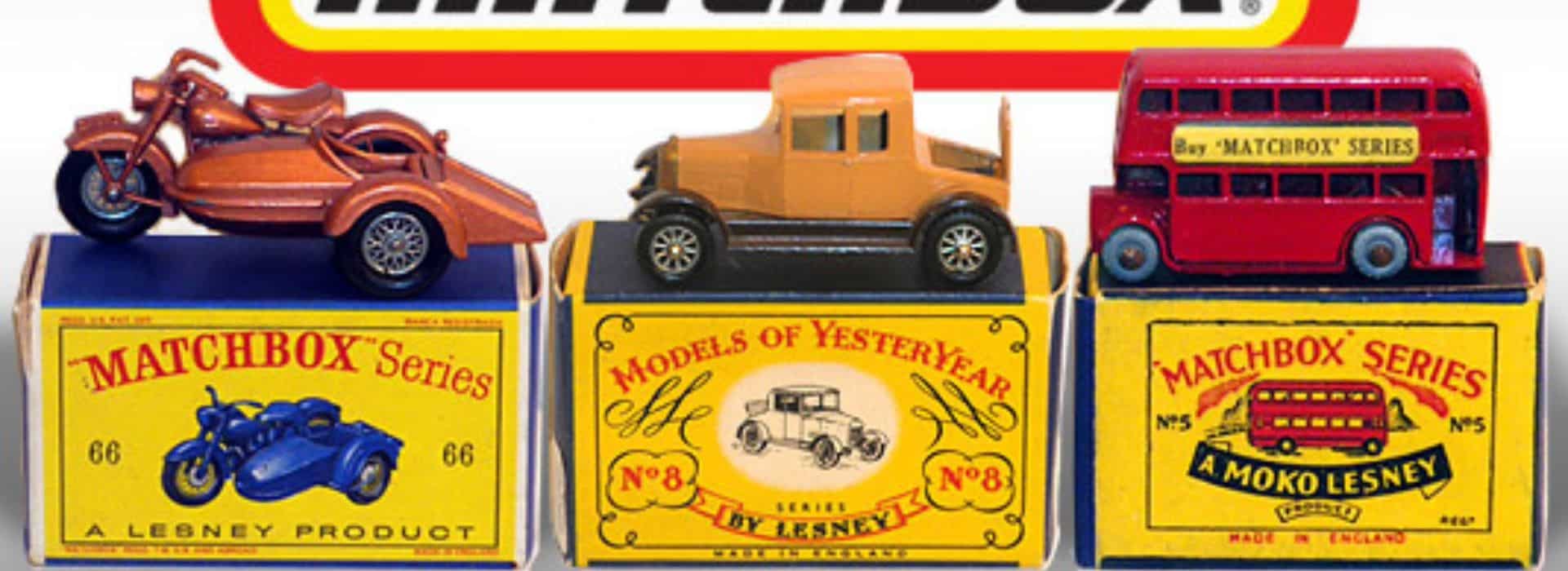 three matchbox cars sitting on their boxes